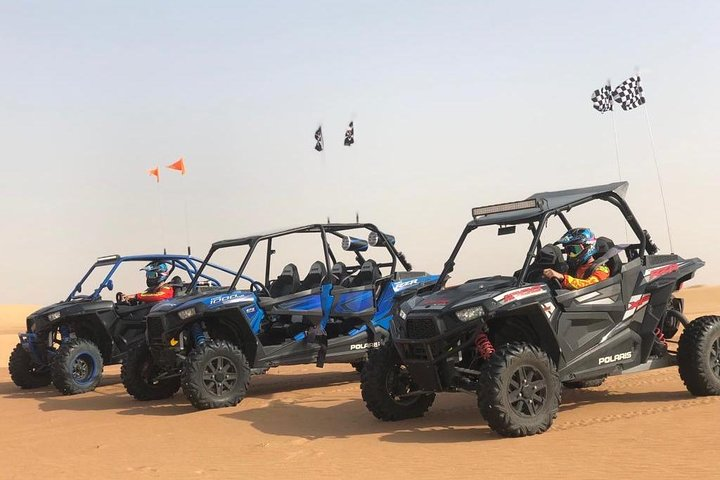Experience the excitement of navigating Dubai's desert in a Polaris RZR 1000cc. Perfect for adventure seekers explore stunning sand dunes with expert guidance and safety gear.